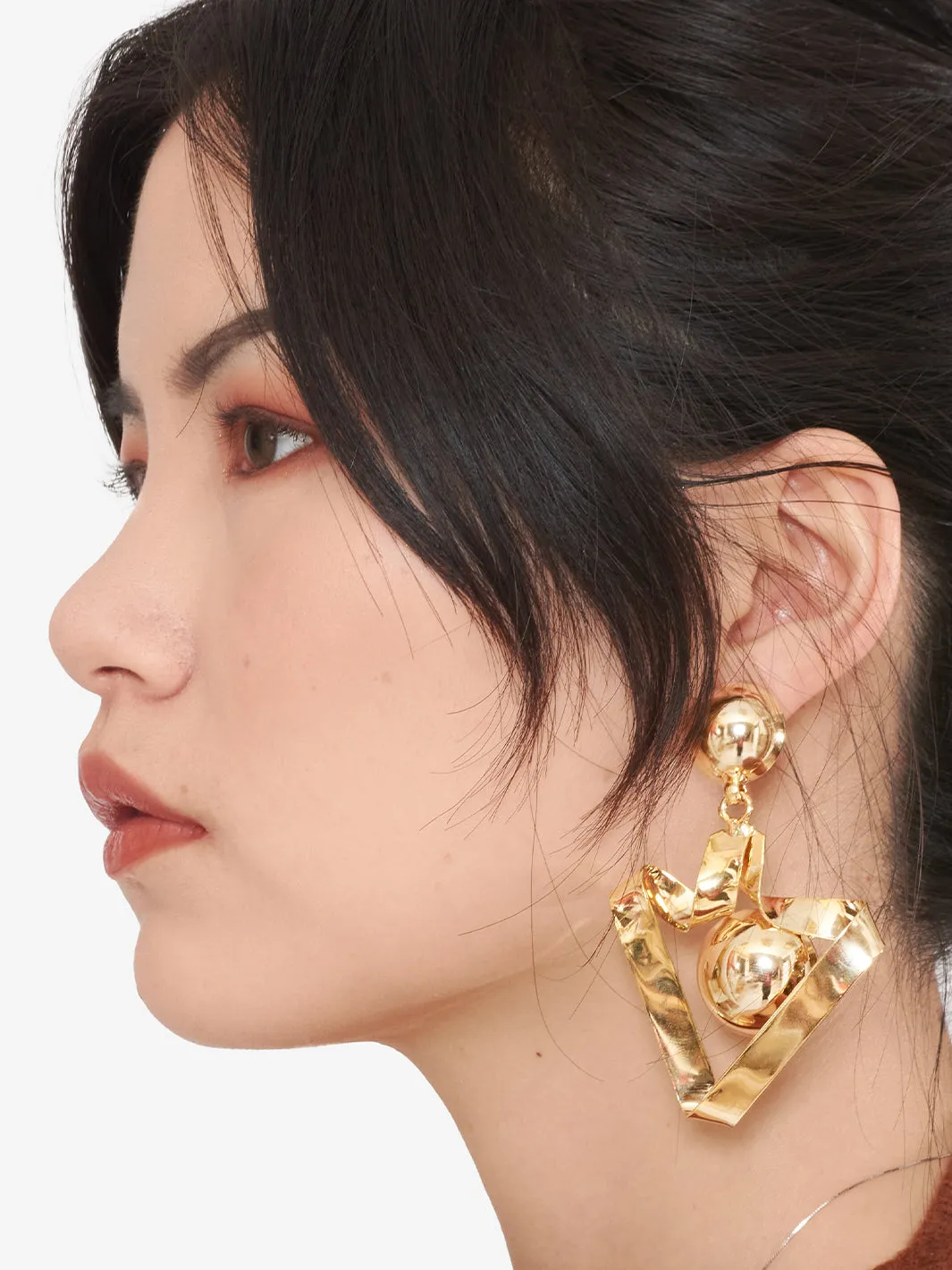 Correani Gold color metal earrings